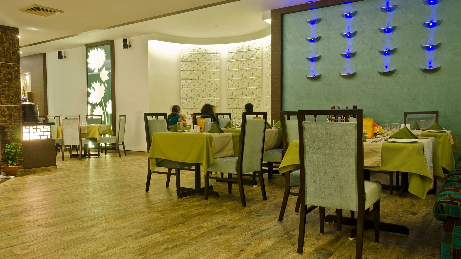 Dining area with tables set and ready, featuring culinary dishes prepared for serving guests.