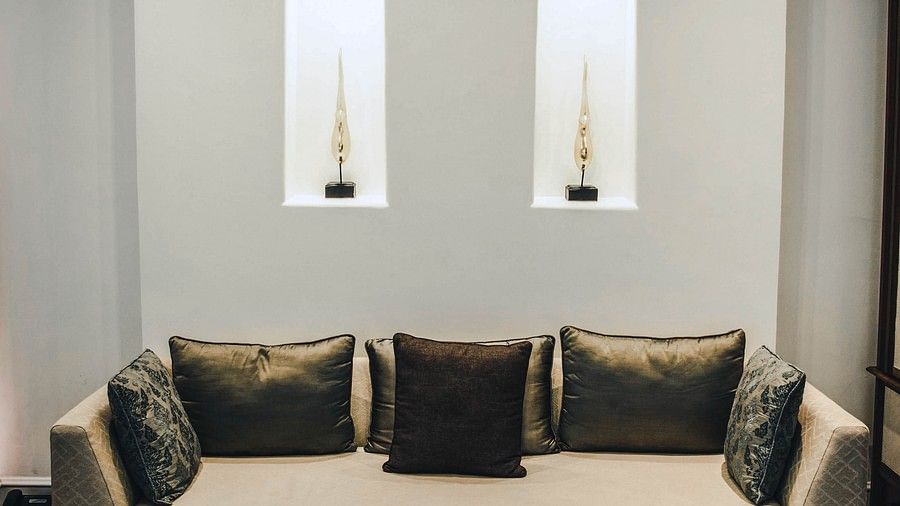 image of an elegant beige coloured couch with a coffee table - two bedroom private pool beachfront villa
