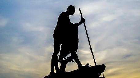 An overview of Mahatma Gandhi's statue in Marina Beach with the silhouette in view.