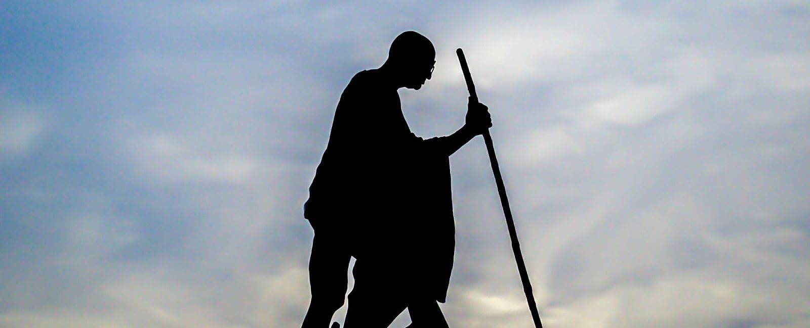 An overview of Mahatma Gandhi's statue in Marina Beach with the silhouette in view.