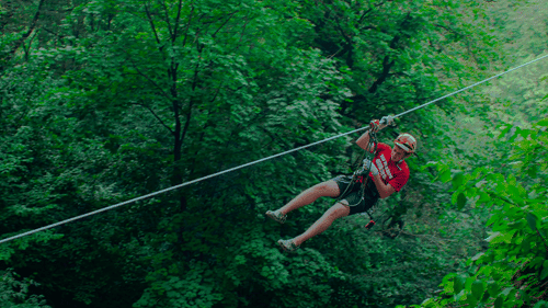 A person enjoying a zip line activity 