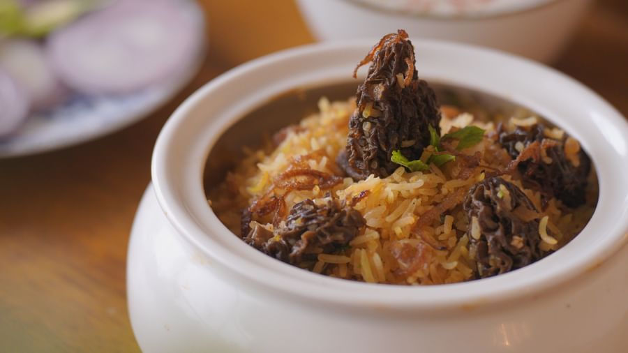 Close-up of a traditional Indian dish served in a white ceramic bowl - Mayfair Cafe & Suites, Dalhousie
