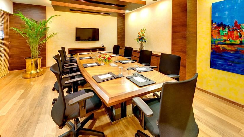 a meeting room table with chairs in a business centre - Kenilworth Hotel, Kolkata