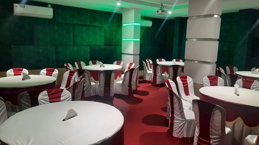 Mysore Gate Hotel, Bangalore Bengaluru A banquet hall featuring well decorated seating arrangements - Mysore Gate Hotel Bangalore