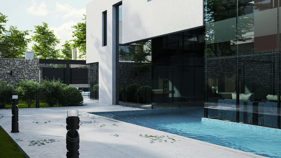 A modern building with large glass walls next to a swimming pool and an outdoor stone walkway.