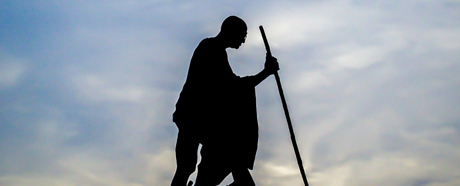 An overview of Mahatma Gandhi's statue in Marina Beach with the silhouette in view.