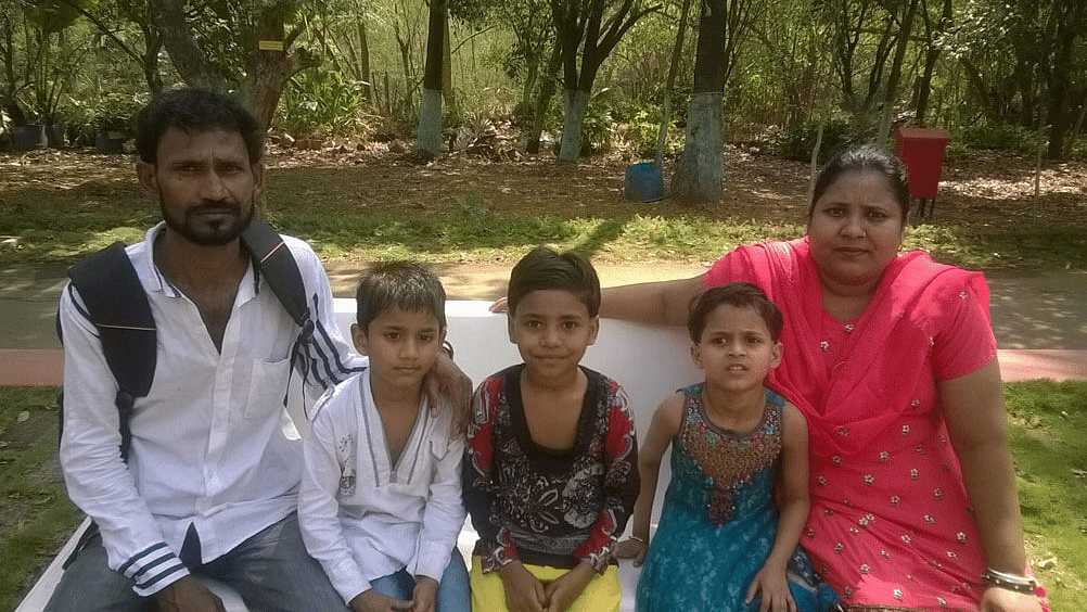 a family posing for the camera during daytime