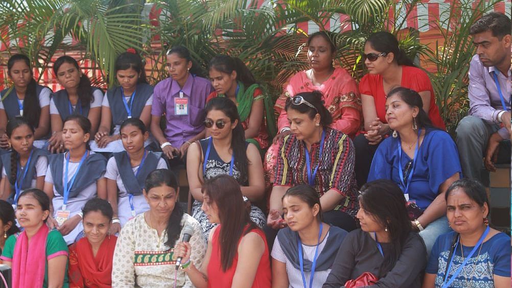 Water Kingdom - a group of school children in uniform and adults