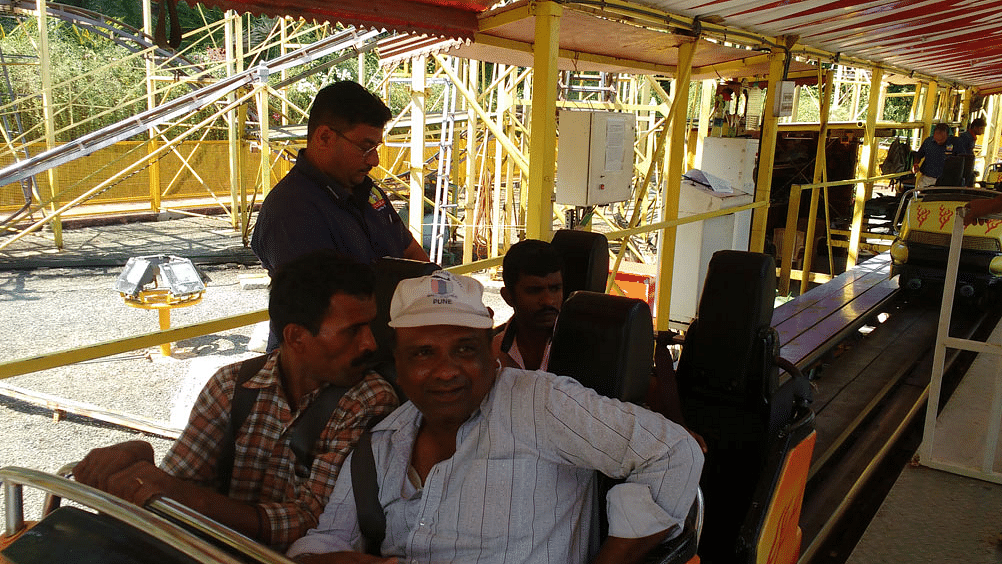 a group of people on a parked ride