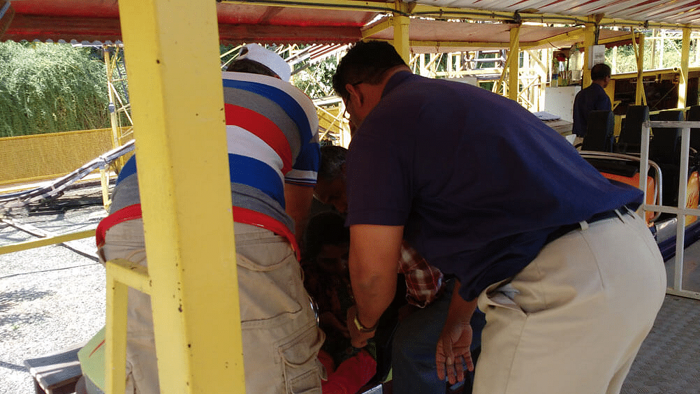 people helping another person onto a ride