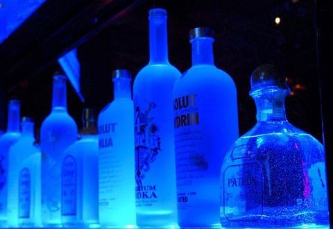 Image of different variety of bottles placed on a flat surface at Parampara Resort & Spa, Kushalnagar.
