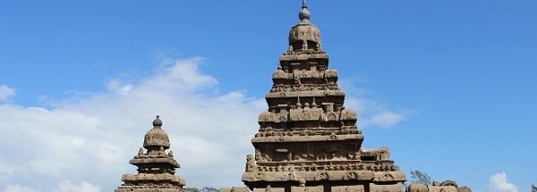 A stone temple structure with 2 towers, multiple sculptures and carvings near Hotel Mamallaa Heritage, Mahabalipuram.