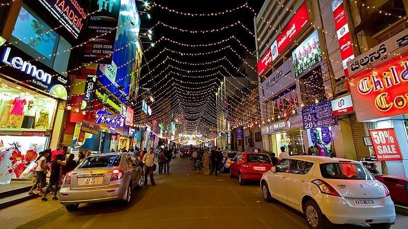 Vibrant shopping street with narrow lanes, small shops, and a mix of locals and tourists.
