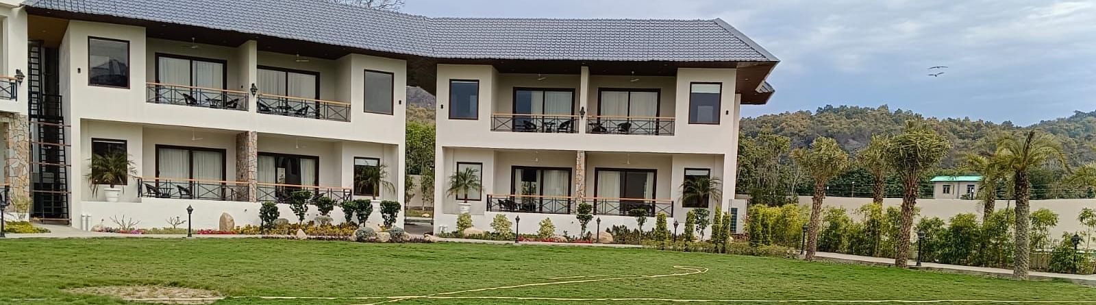 Facade view of the building and foliage in front of the property building- Shervani Pebbles & Pines, Corbette
