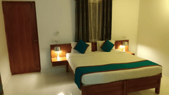CCosy room with double bed, warm lamps, and curtains at Fantasy Golf Resort.