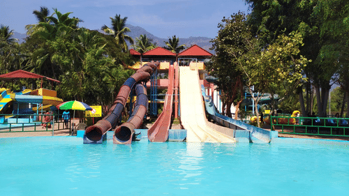 Black Thunder featuring multiple water slides, including a spiral and a straight slide, leading into a pool.