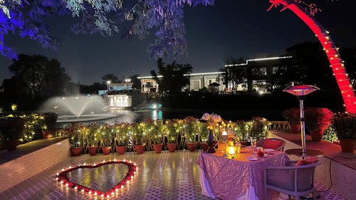 A decorated space with lights on in the night - Karma Lakelands.