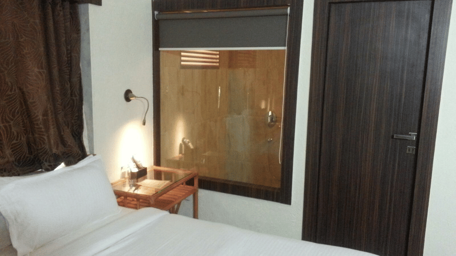 Adamo Resort Matheran - A close up view of bed offered in Bungalow Bedroom 1
