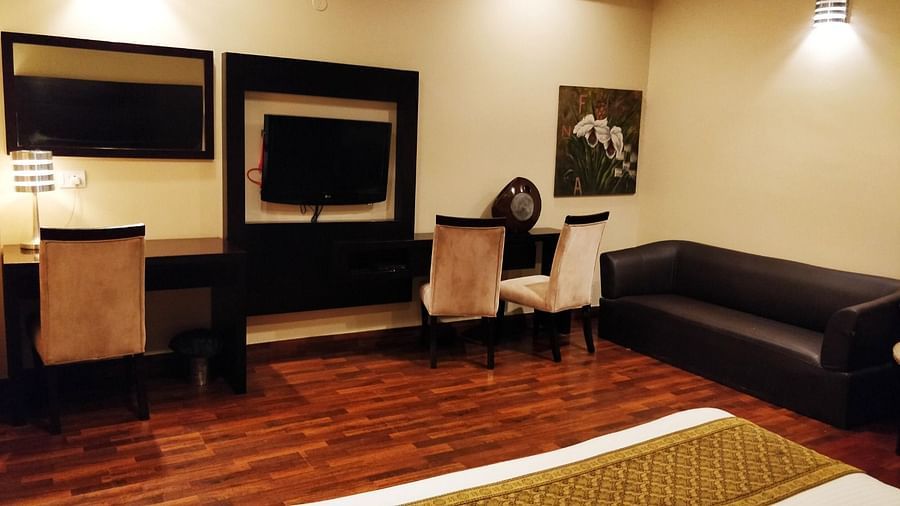 Executive Suite with sofa television and chair - Five Elements The Claire, Gurugram