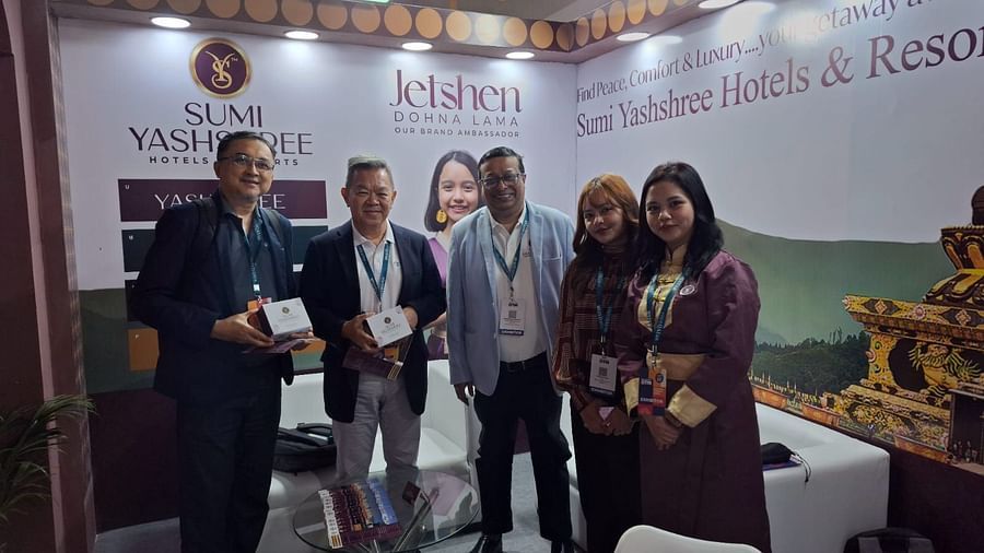 Team members and guests at the Sumi Yashshree Hotels & Resorts booth, showcasing the brand's commitment to peace, comfort, and luxury.