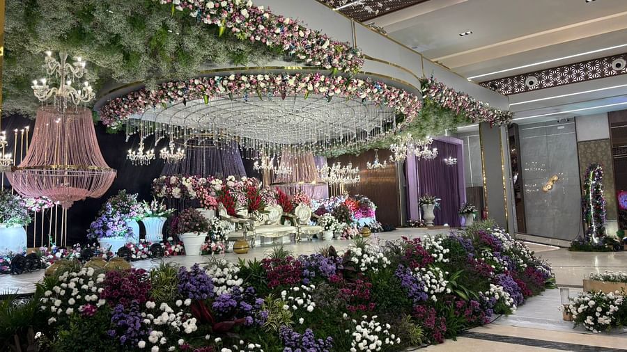 Elegant wedding stage with floral decor and chandeliers.  | VRR Astoria Hotel and Conventional Centre