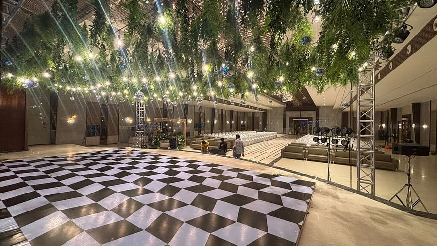 Outdoor Dining Space Featuring Checkered Flooring and String Lights - VRR Astoria Hotel and Conventional Centre