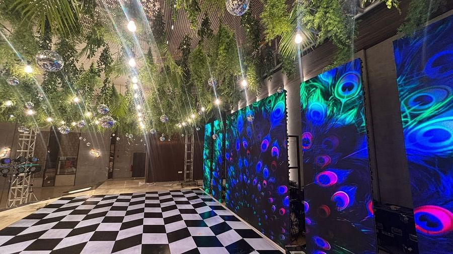 Stylish Outdoor Area with Hanging Plants and Vibrant Lighting - VRR Astoria Hotel and Conventional Centre