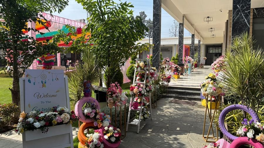 An image of an entrance decorated with bundle of flowers leading to the event hall - VRR Astoria Hotel and Convention Centre