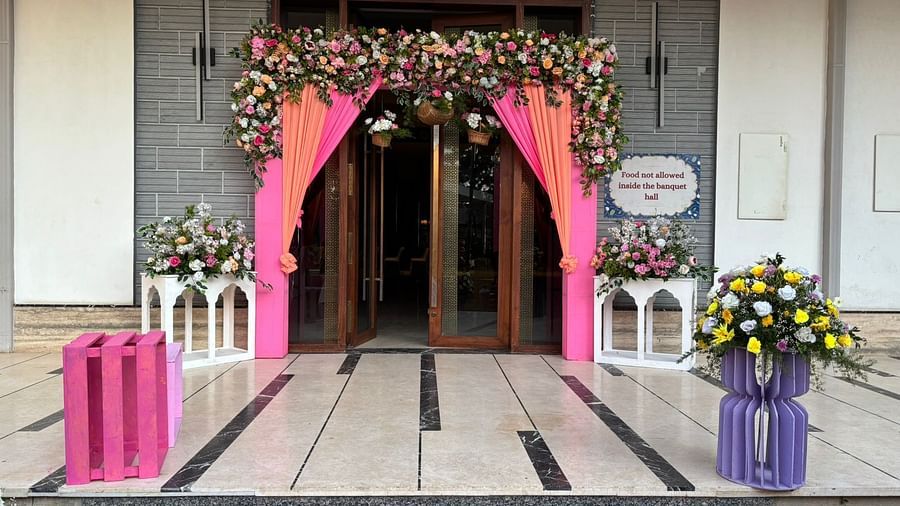 Welcoming entrance with fresh flower arrangements and decor at VRR Astoria Hotel.