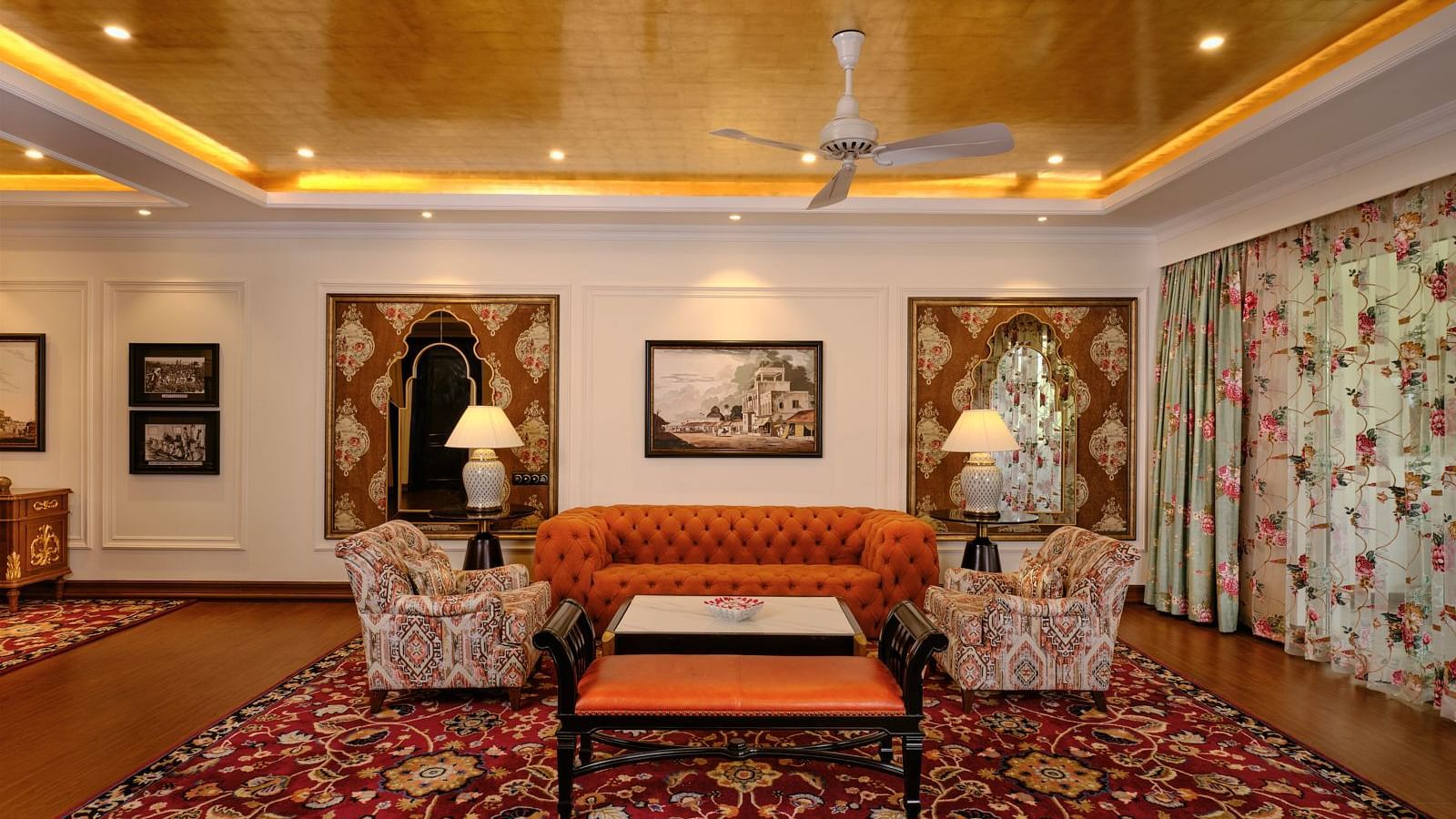 Elegant bedroom with twin chairs, luxurious carpet, and ambient lighting at MAYFAIR Tea Resort, Siliguri