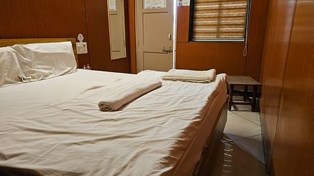 The entrance to the room overlooking the plush double bed with at the Dream Vision Guest House.