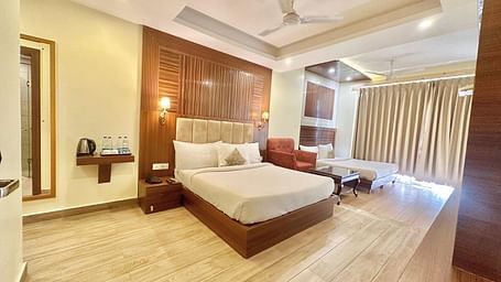 a panoramic image of the family room featuring two comfortable double beds with a false ceiling on the top - ZENQ SIGNATURE INN, MCLEODGANJ