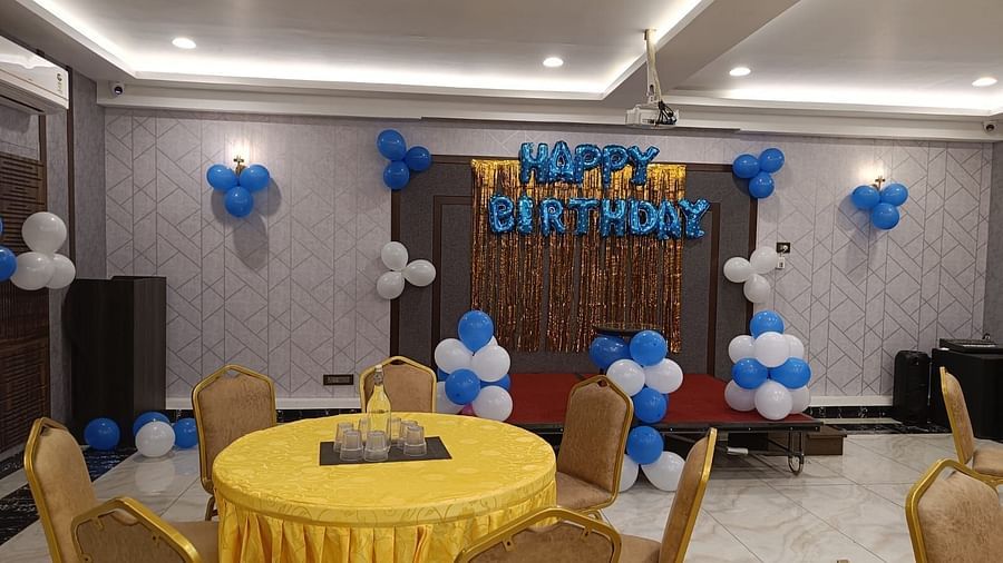 event hall with yellow chairs and tables at Hotel Eastern Gate, Port Blair