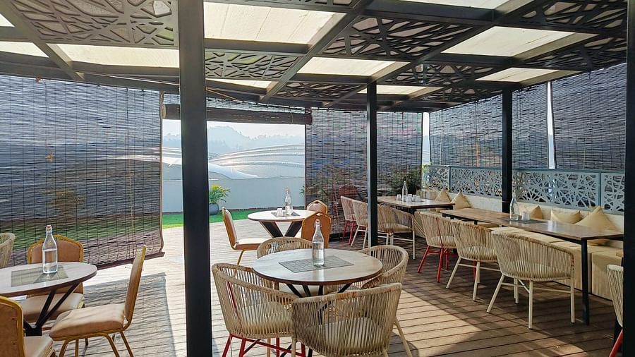 outdoor space with tables and chairs of an event hall at Hotel Eastern Gate, Port Blair