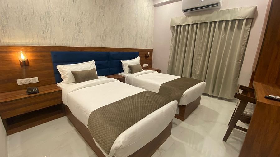 A Comfy twin bed with a study table , AC at at Hotel Mumbai House, Indore