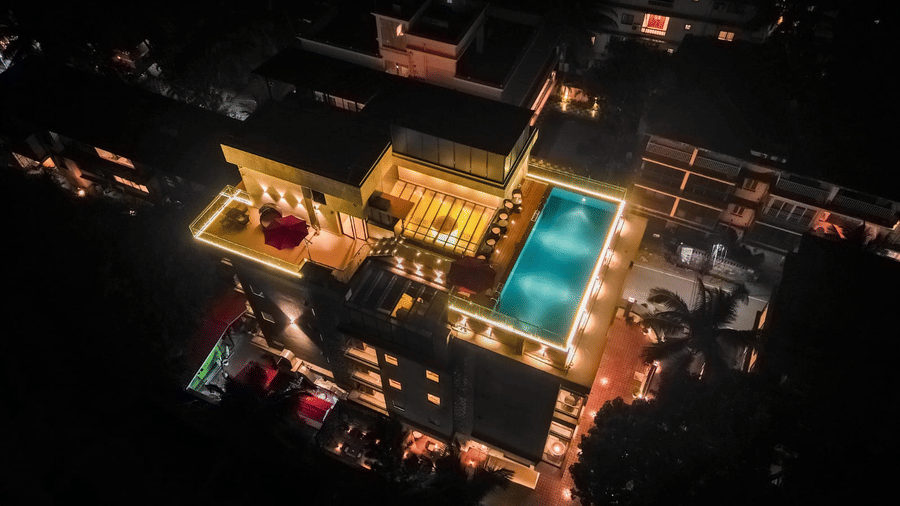 Contemporary exterior of Hotel Southgate Goa, Calangute, showcasing the hotel's modern architecture and welcoming entrance surrounded by a landscaped setting.