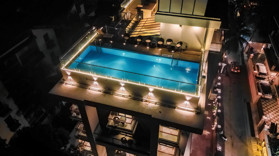 Rooftop swimming pool with surrounding seating and open views at Hotel Southgate Goa, Calangute, offering guests a refreshing place to relax and unwind.