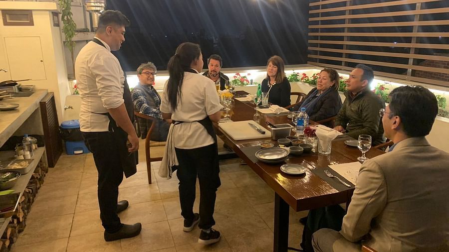 A group of people gathered for the chefs table dinner