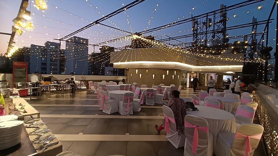 Image of a terrace with chairs and tables arranged for an event at The Oriental Residency