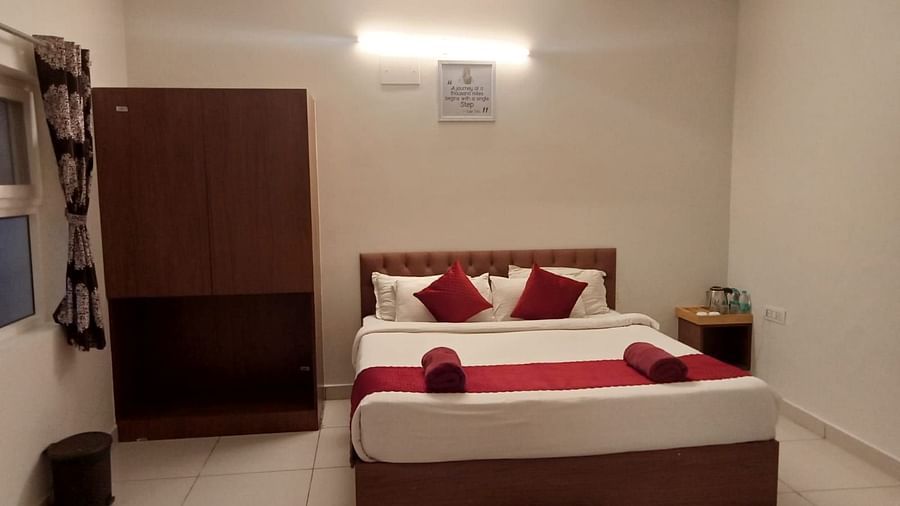 A front view of the bed with plush bedding | Vistar Resort, Bengaluru