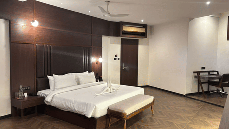 Interior view of bedroom and entrance at Lords Riverside Resort, Muduba - Shivamogga