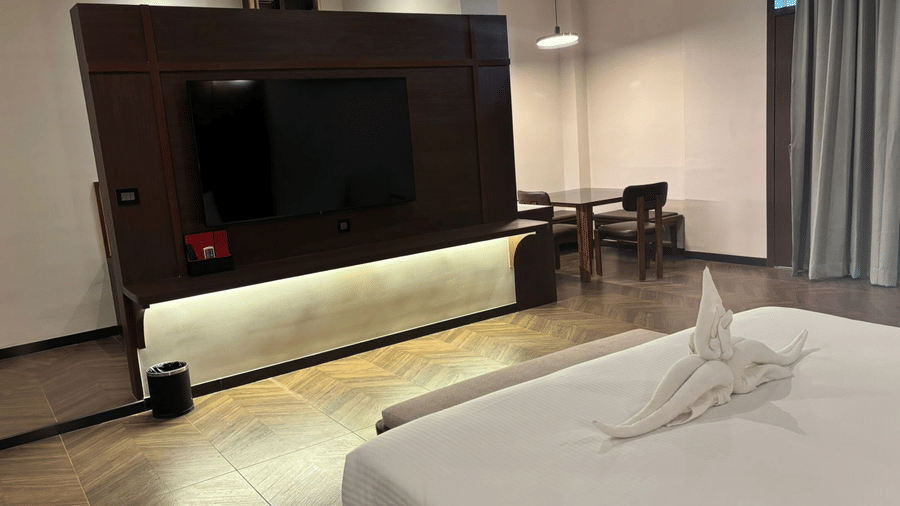 Flat-screen TV and modern console at Lords Riverside Resort, Muduba - Shivamogga