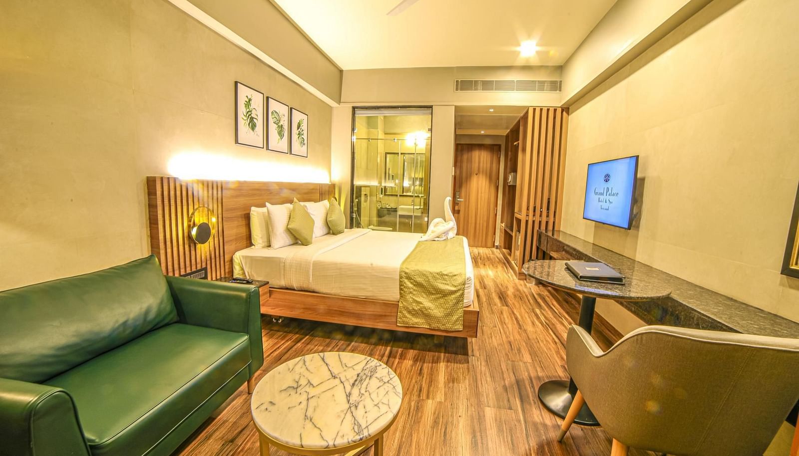 Side view of the double bed in the Premium Balcony Room at Grand Palace, Yercaud