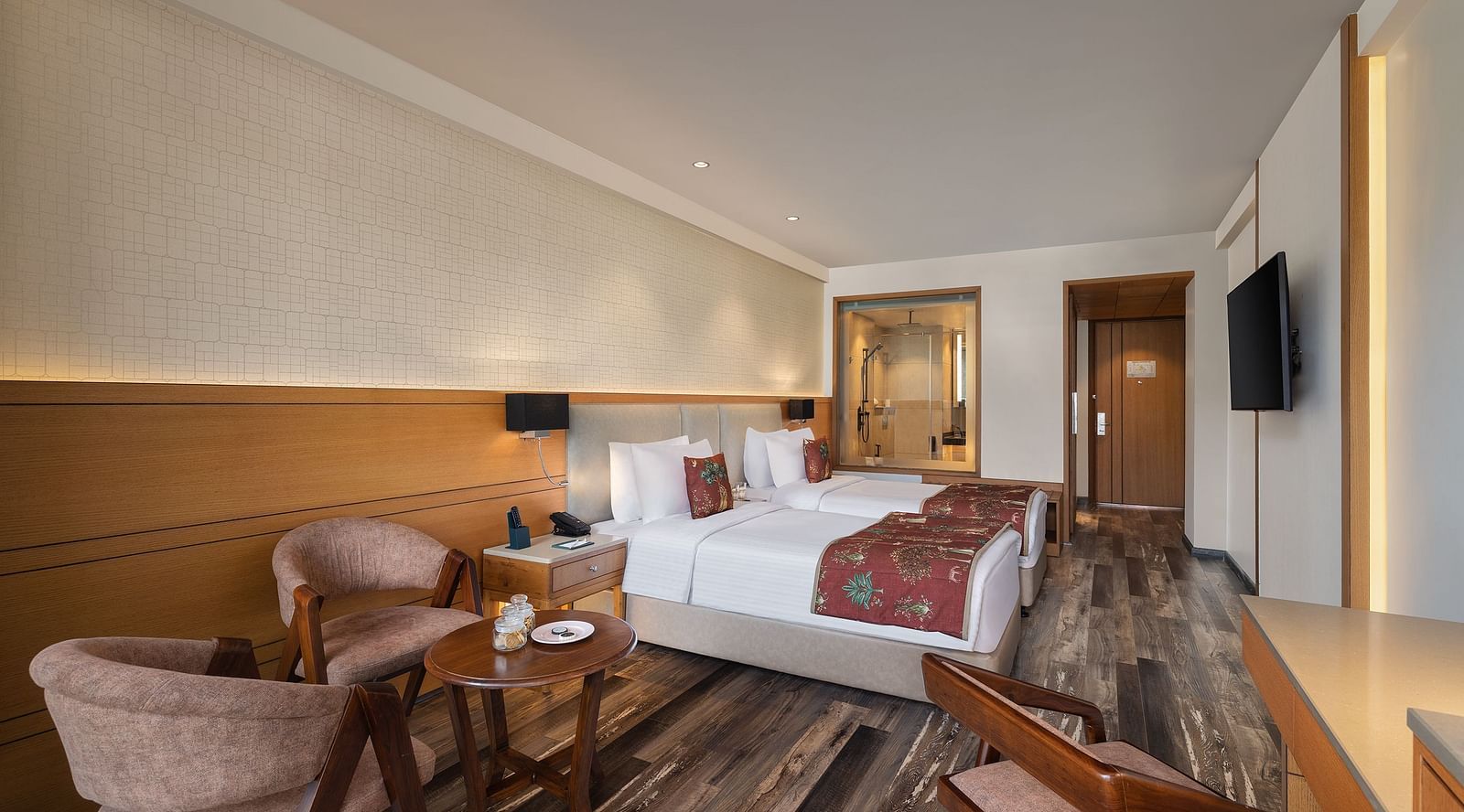 Premium peaks room with a double bed, chairs and a television