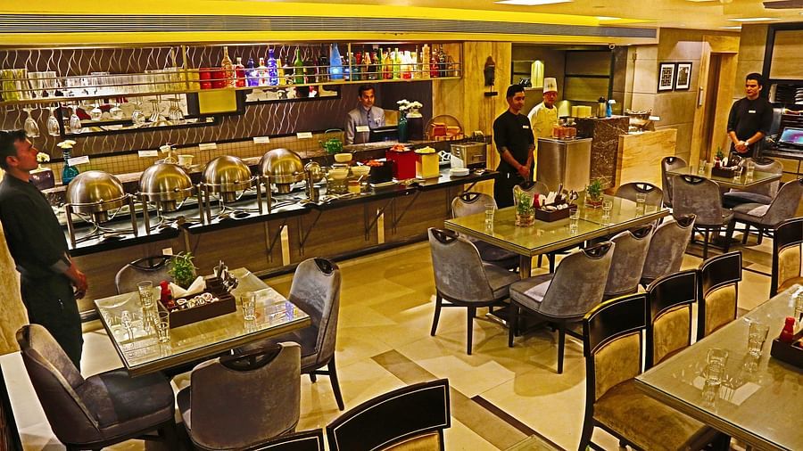 Image of a dining space with chairs and tables at The Oriental Residency