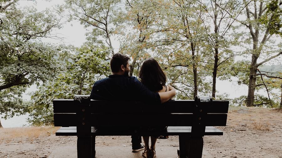 couple sitting at a bench