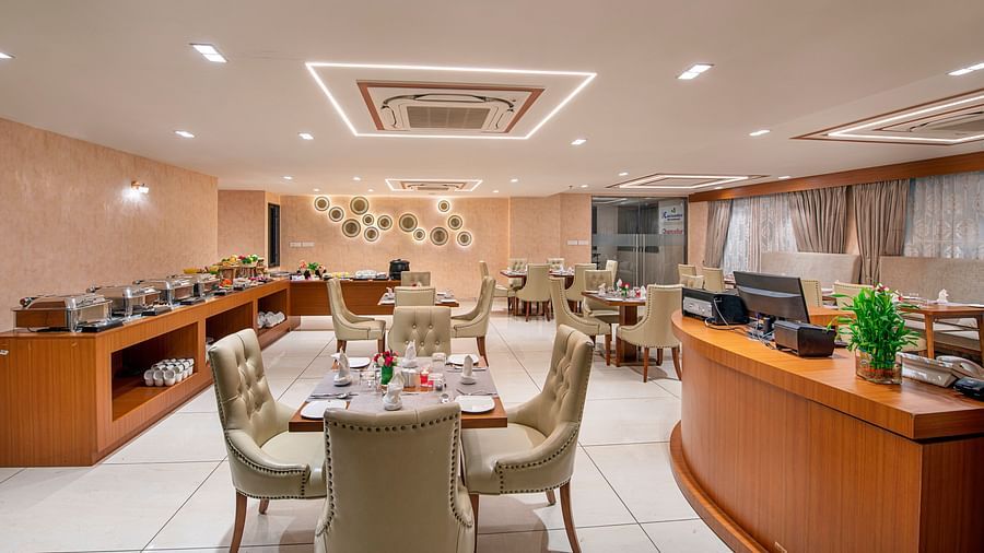 A hotel buffet area with food warmers and serving stations, ready for guests - SK Lords Inn Ahmedabad