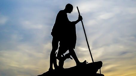 An overview of Mahatma Gandhi's statue in Marina Beach with the silhouette in view.