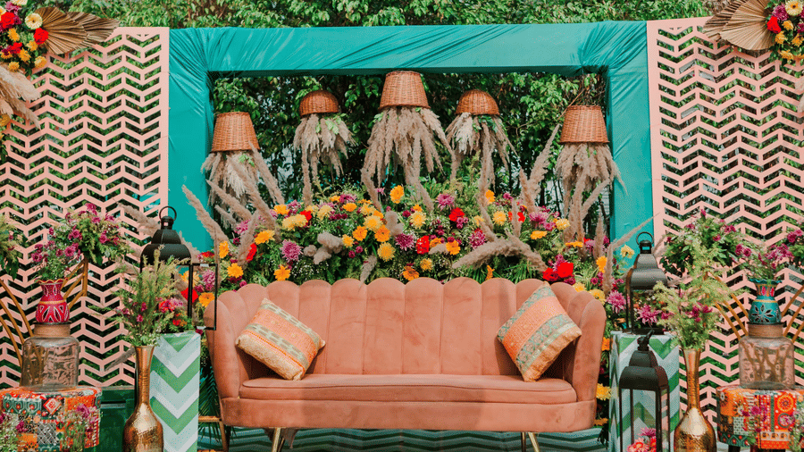 Decorated wedding stage at Marasa Sarovar Premiere, Bodhgaya featuring patterned flooring, floral backdrop, overhead decor, and central seating