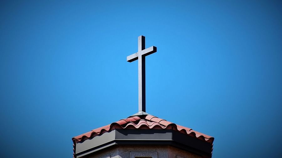 image featuring The Holy Cross located above a Church building